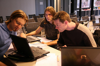 3 students working on a laptop