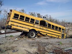 Damaged school bus sits among wreckage in Post-Hurricane Katrina Mississippi