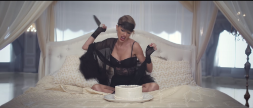 Picture shows Taylor Swift about to stab a cake, an image from her video for "Blank Space."