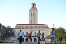 students posing in front of UT tower