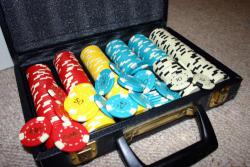 Set of multicolored poker chips in case